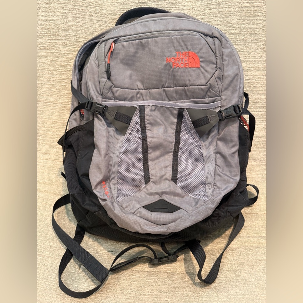 The North Face Gray and Black Backpack with Orange Logo